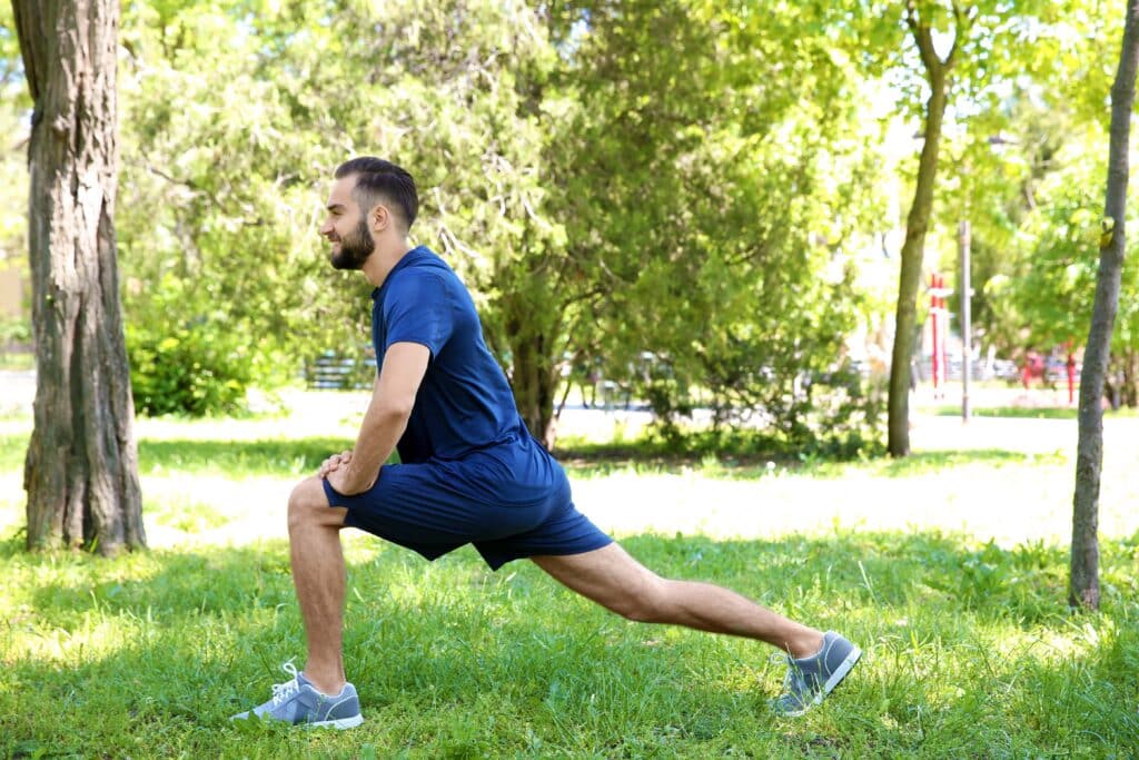 Man lunging outdoors in park